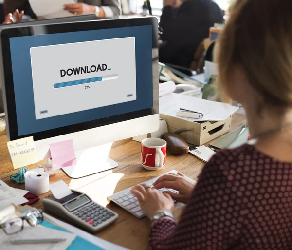 Businesswoman working on computer with Download — Stock Photo, Image