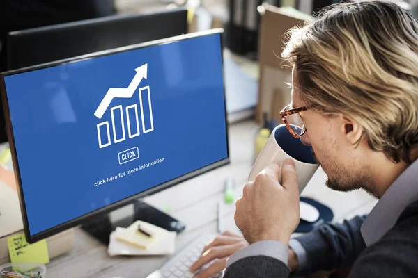 Businessman working on computer with graph — Stock Photo, Image