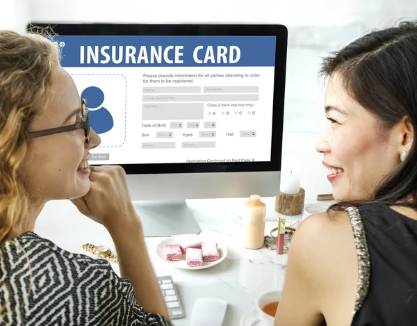 Women talking and using computer — Stock Photo, Image