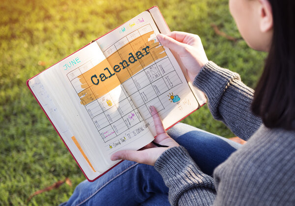 woman holding notebook