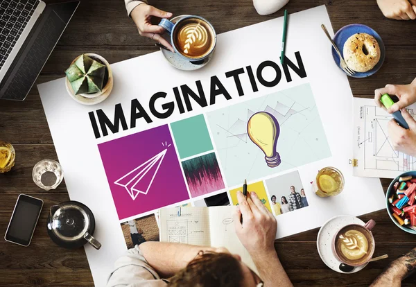 Mesa con póster con Imaginación — Foto de Stock