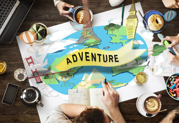 People sit at table with coffee in cafe, top view on wooden table with poster with Adventure concept