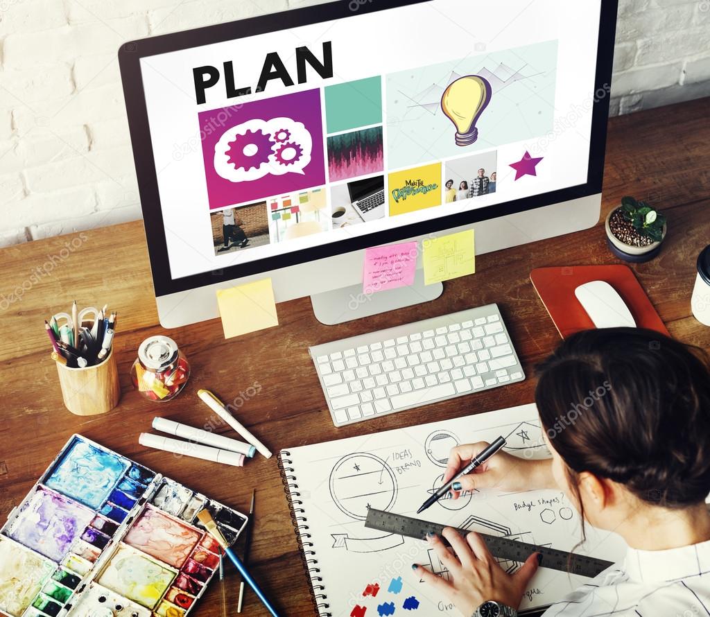 Young girl drawing in diary in desing studio with computer, Plan Concept