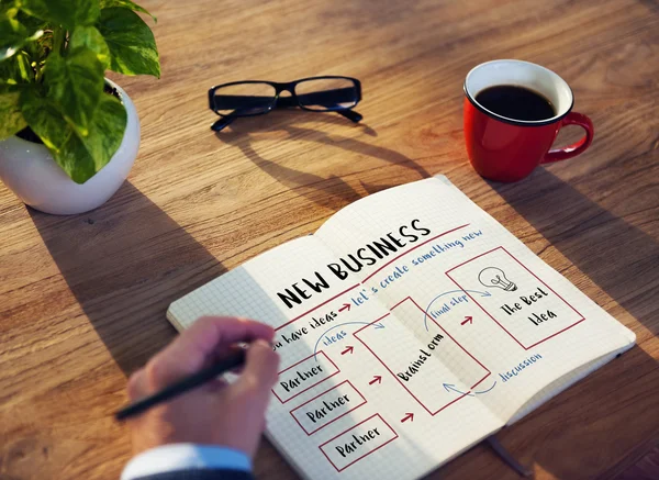 Businessman writing in notebook — Stock Photo, Image