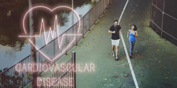 Sportliches Paar läuft auf Straße — Stockfoto