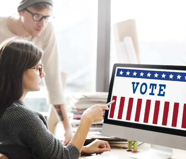 Woman showing on monitor with vote — Stock Photo, Image