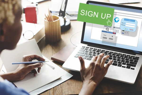 Woman working on laptop with Sign Up — Stock Photo, Image