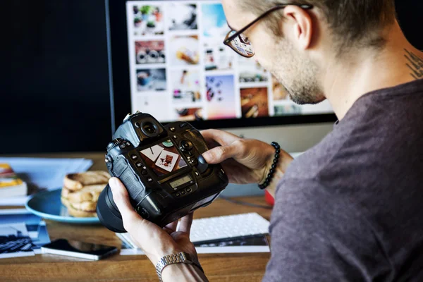 man working with  camera