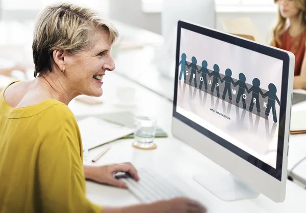 Computer with Group Work on monitor — Stock Photo, Image