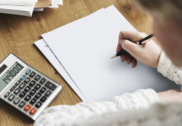 Person writing on white paper — Stock Photo, Image