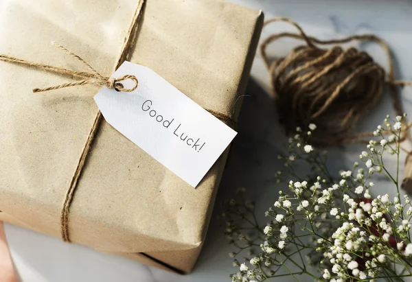 Paper wrapped gift with Label Tag — Stock Photo, Image