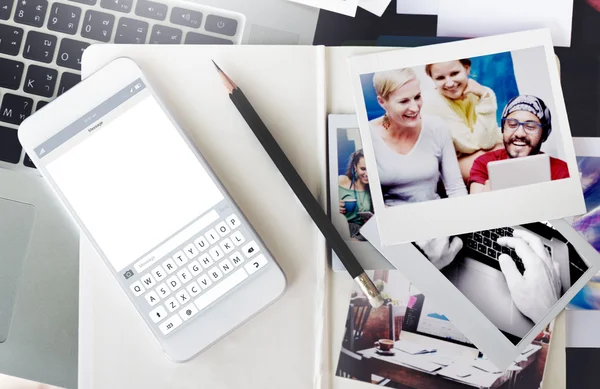 Photo cards and smartphone on the table — Stock Photo, Image