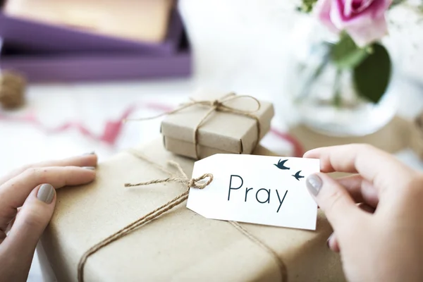 Paper wrapped gift with label tag — Stock Photo, Image