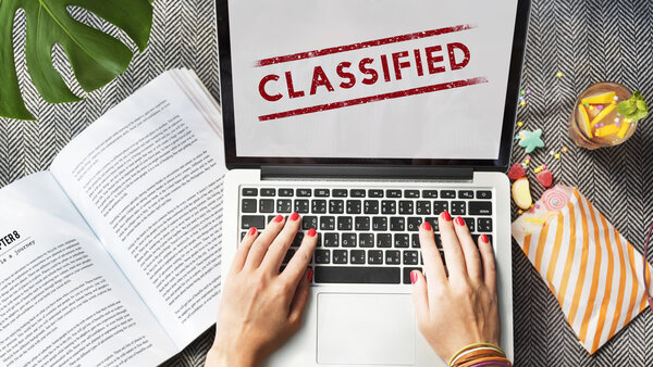 Woman working with Classfied Concept