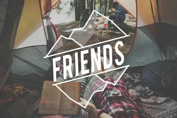 Friends relaxing in tent — Stock Photo, Image