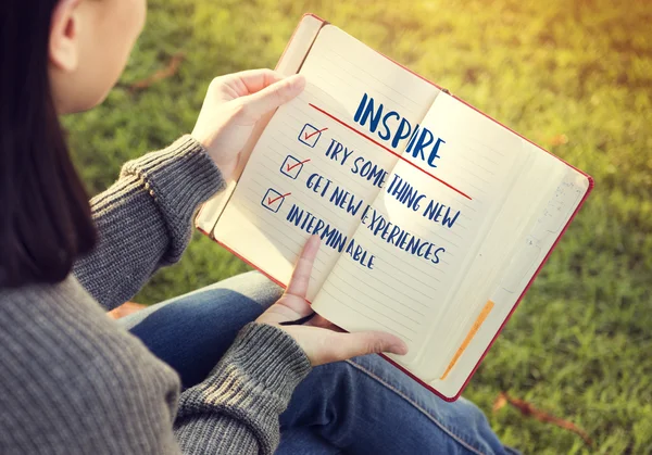 Woman with paper notebook in hands — Stock Photo, Image