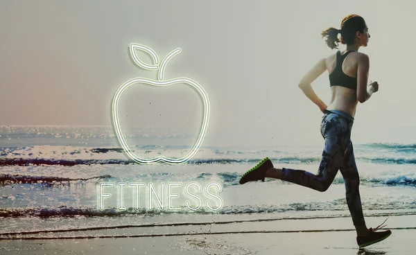 Woman in leggings running on beach — Stock Photo, Image