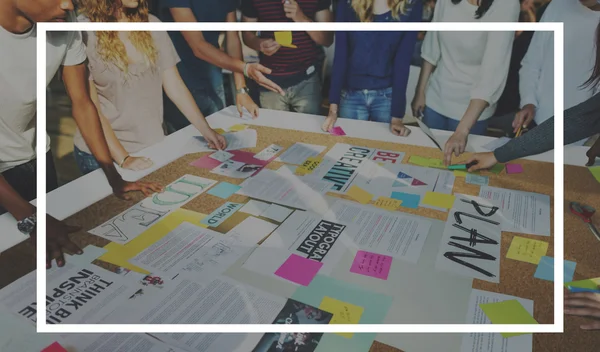 Group of students at workplace table — Stock Photo, Image