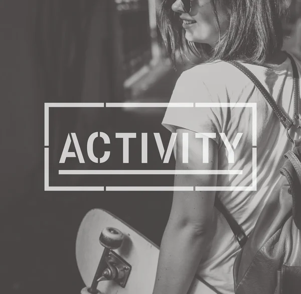 Young woman with skateboard — Stock Photo, Image