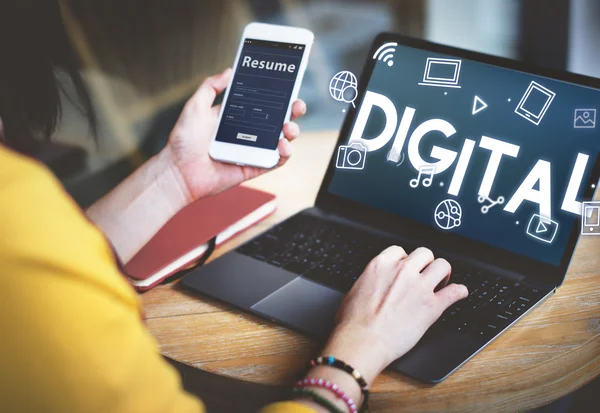 Woman with laptop and phone — Stock Photo, Image