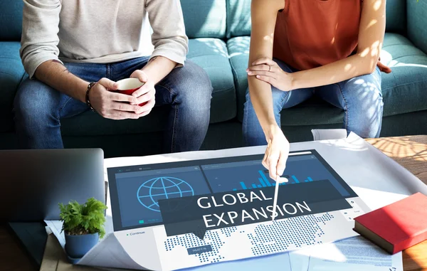 Woman showing on poster with Global Expansion — Stock Photo, Image