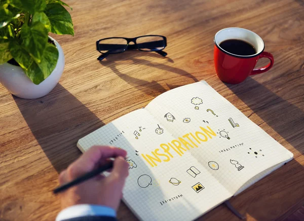 Businessman writing notes in diary — Stock Photo, Image