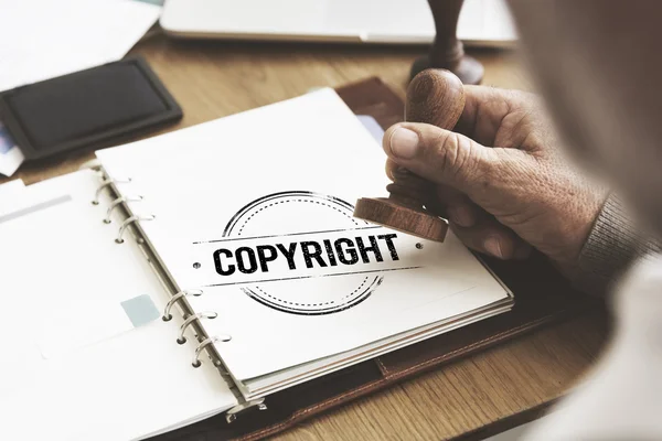 Timbro nel quaderno con Copyright — Foto Stock