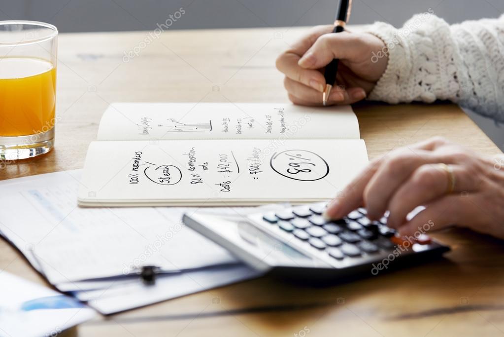 person writing financial budget