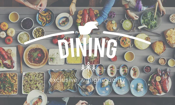 Friends eating variety food at the table — Stock Photo, Image