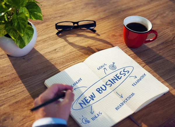 Businessman writing in notebook — Stock Photo, Image