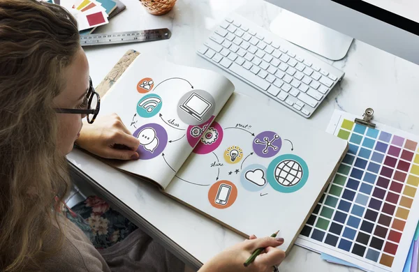 Woman with sketch-book in office — Stock Photo, Image