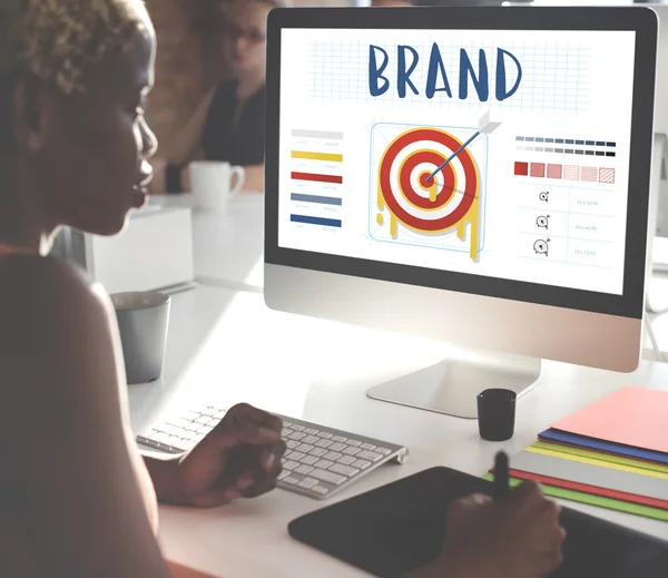 Businesswoman working on computer with Brand — Stock Photo, Image