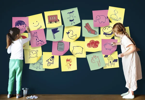 Girls drawing on Blackboard — Stock Photo, Image