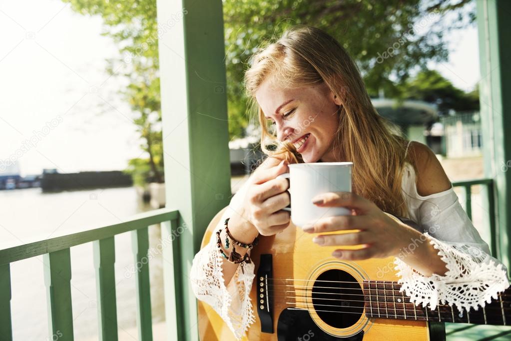 Guitarist woman drinking tea