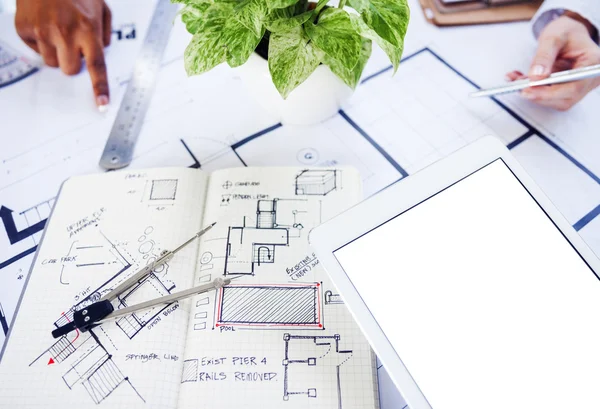 Workplace table with architect blueprints — Stock Photo, Image