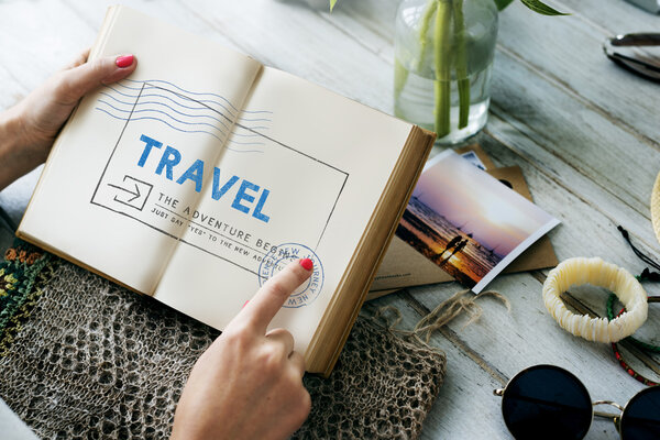 Woman hands with diary, Graphic Concept. Text: Travel