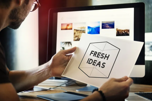 Man designer holding picture — Stock Photo, Image