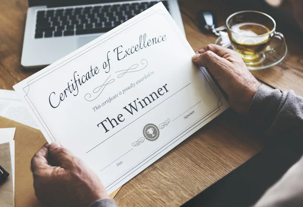 Piece of paper with certificate of Excellence — Stock Photo, Image