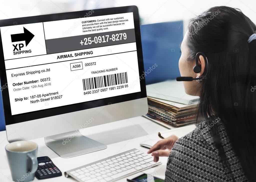 businesswoman working on computer with shipping