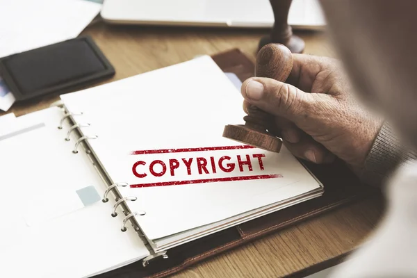 Sello en cuaderno con Copyright — Foto de Stock