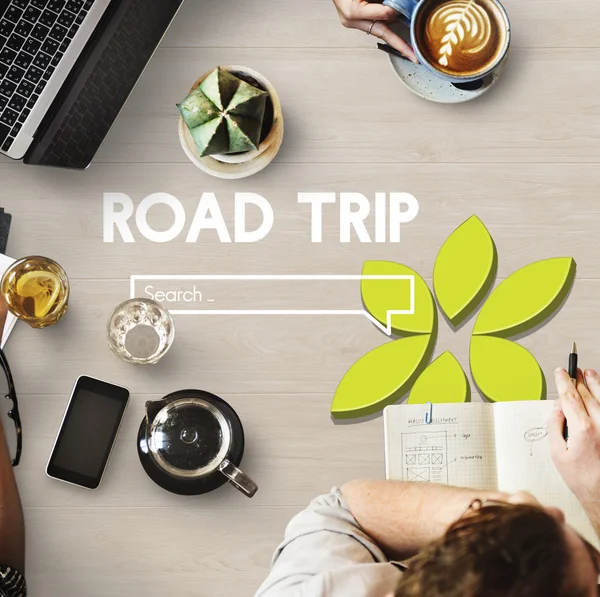 Table with poster with Road Trip — Stock Photo, Image