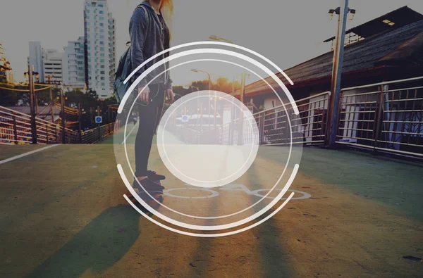 Woman riding on skateboard in city — Stock Photo, Image