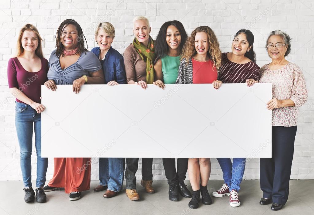 women holding informational board