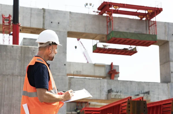 Engineer Worker writing building plan — Stock Photo, Image