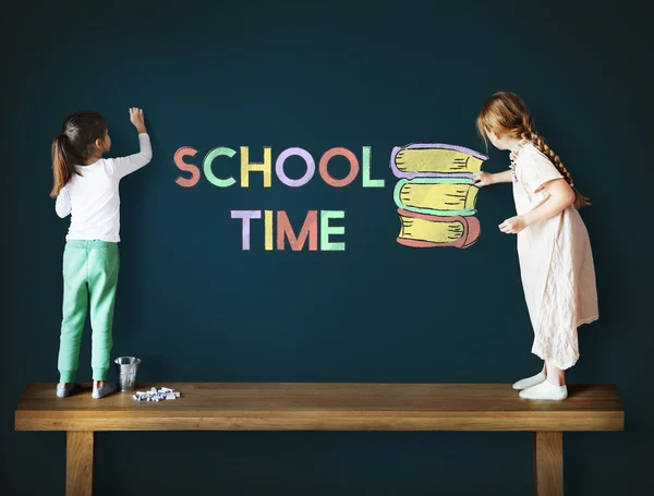 Girls drawing on Blackboard — Stock Photo, Image