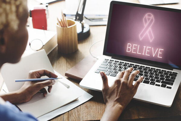 woman working on laptop with Believe