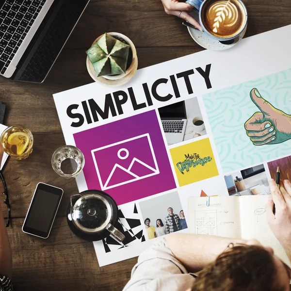 Mesa con póster con Simplicidad —  Fotos de Stock