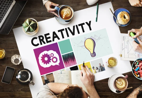 Table with poster with Creativity — Stock Photo, Image