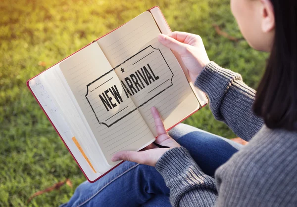 Woman with paper notebook in hands — Stock Photo, Image