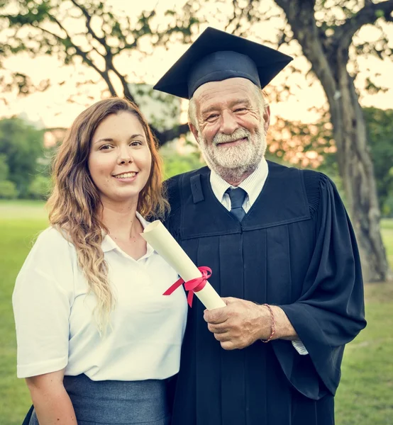 Senior man holding diploma — Stock Photo, Image